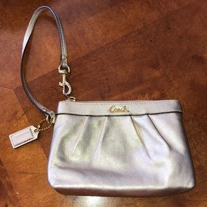 Gold coach zip wristlet